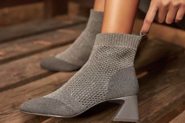 perforated ankle bootie on an architectural block heel made with recycled material